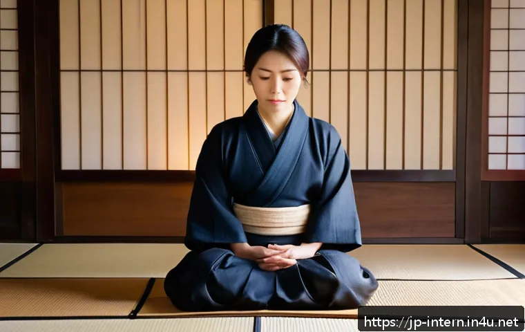 소화기질환 응급처치 방법 - A calm Japanese woman in her 30s sitting quietly on a tatami mat floor, gently holding her lower rig...
